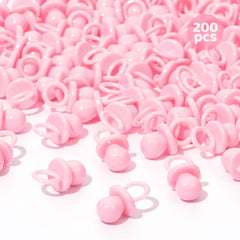 ZYFLSQ pink 200 mini pacifiers scattered on a table for baby shower decor