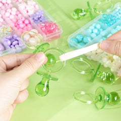 ZYFLSQ green pacifiers used as Hunt Pacifier game props for fun.