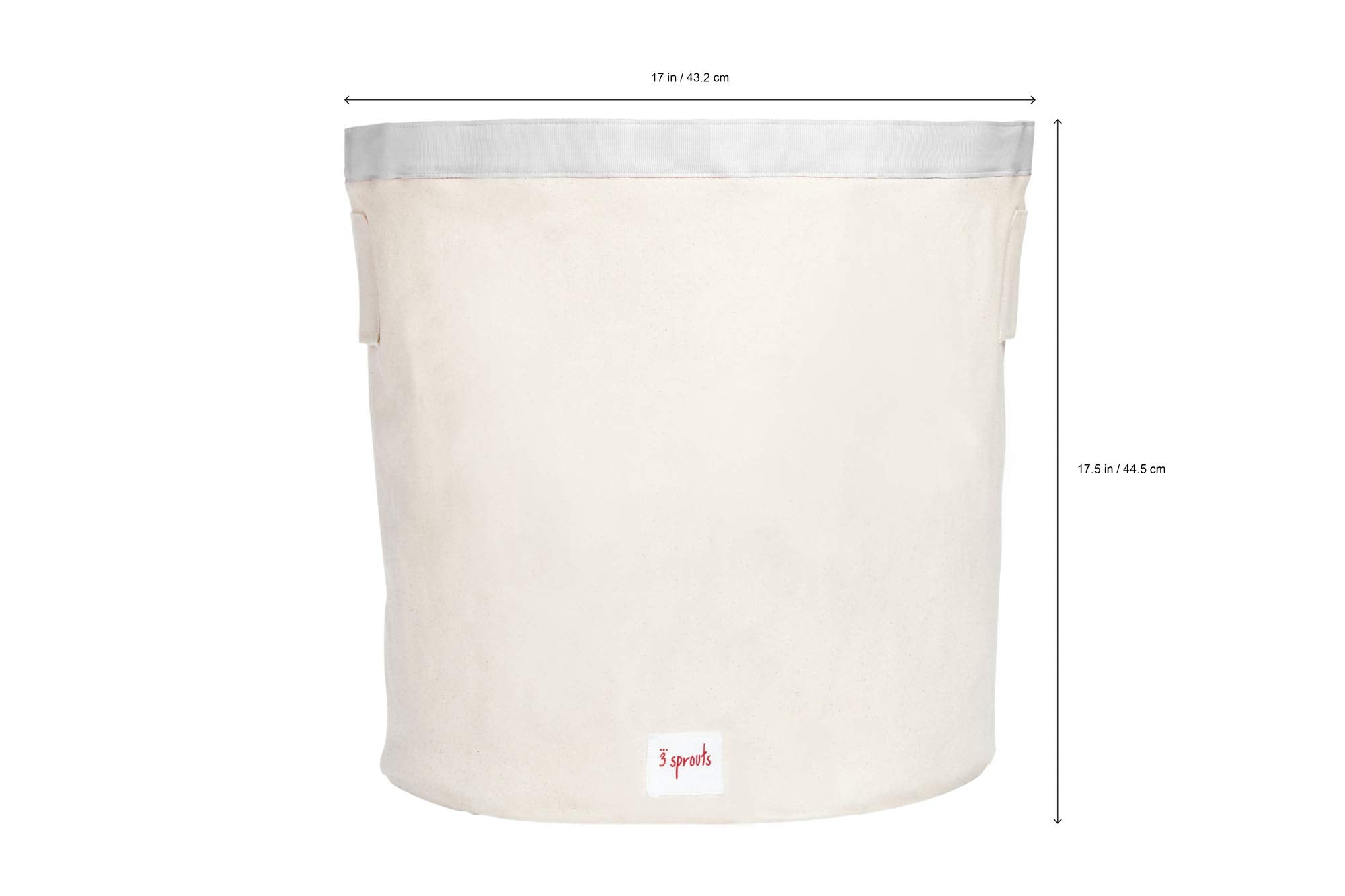 3 Sprouts canvas storage bin in nursery for blankets and plush toys.