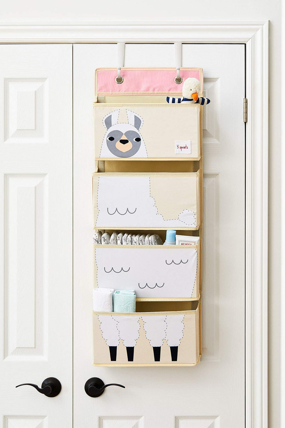 3 Sprouts door-hanger storage solution saves floor space in the nursery.