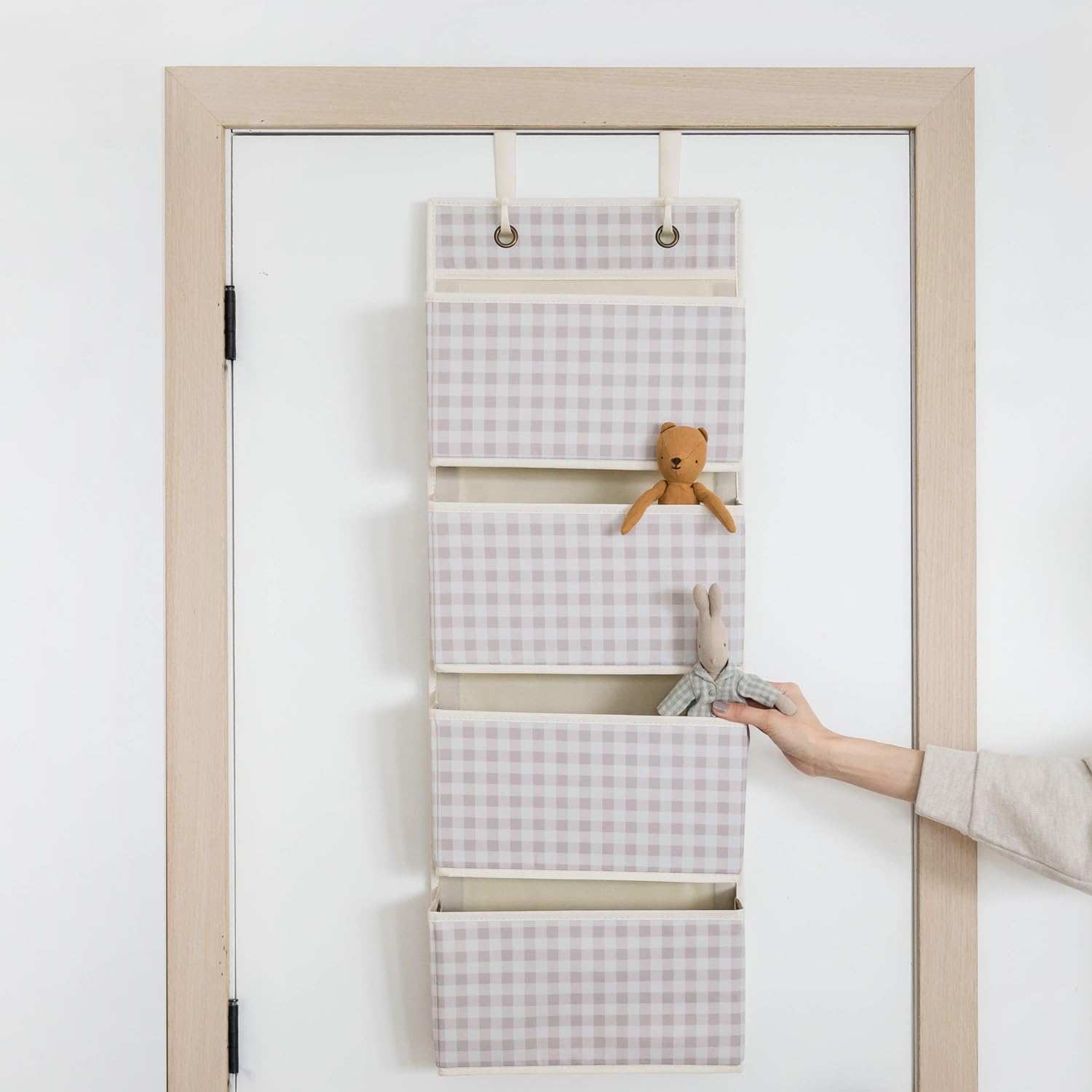 3 Sprouts nursery decor in gingham beige adding stylish storage.