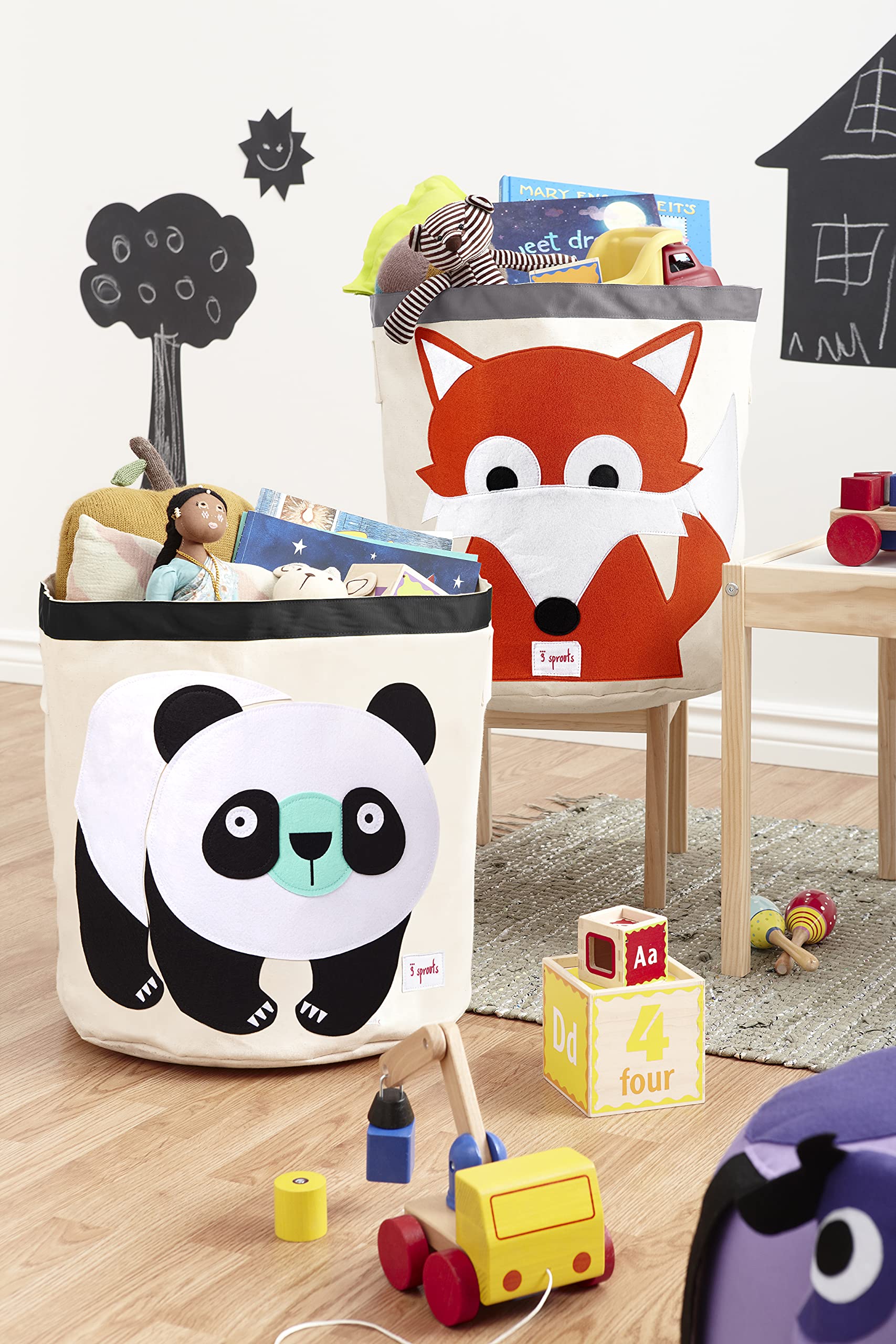 3 Sprouts panda round laundry hamper keeps laundry organized in a nursery.