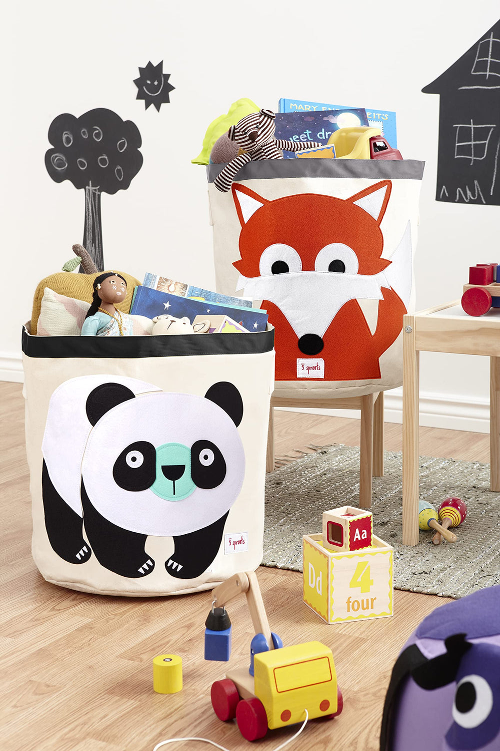 3 Sprouts panda round laundry hamper keeps laundry organized in a nursery.