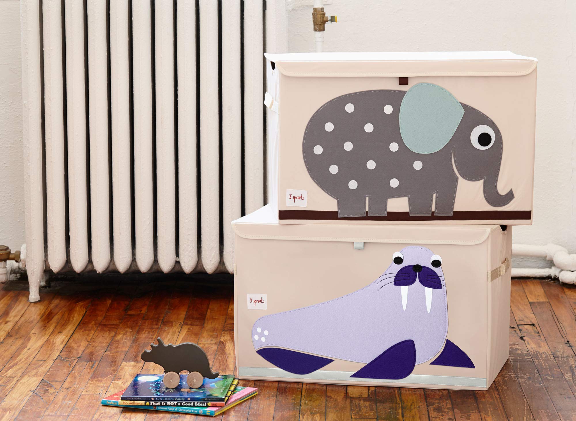 Three Sprouts sturdy side handles make lifting toy storage simple and safe.