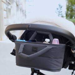 Adjustable straps secure the organizer to most strollers.