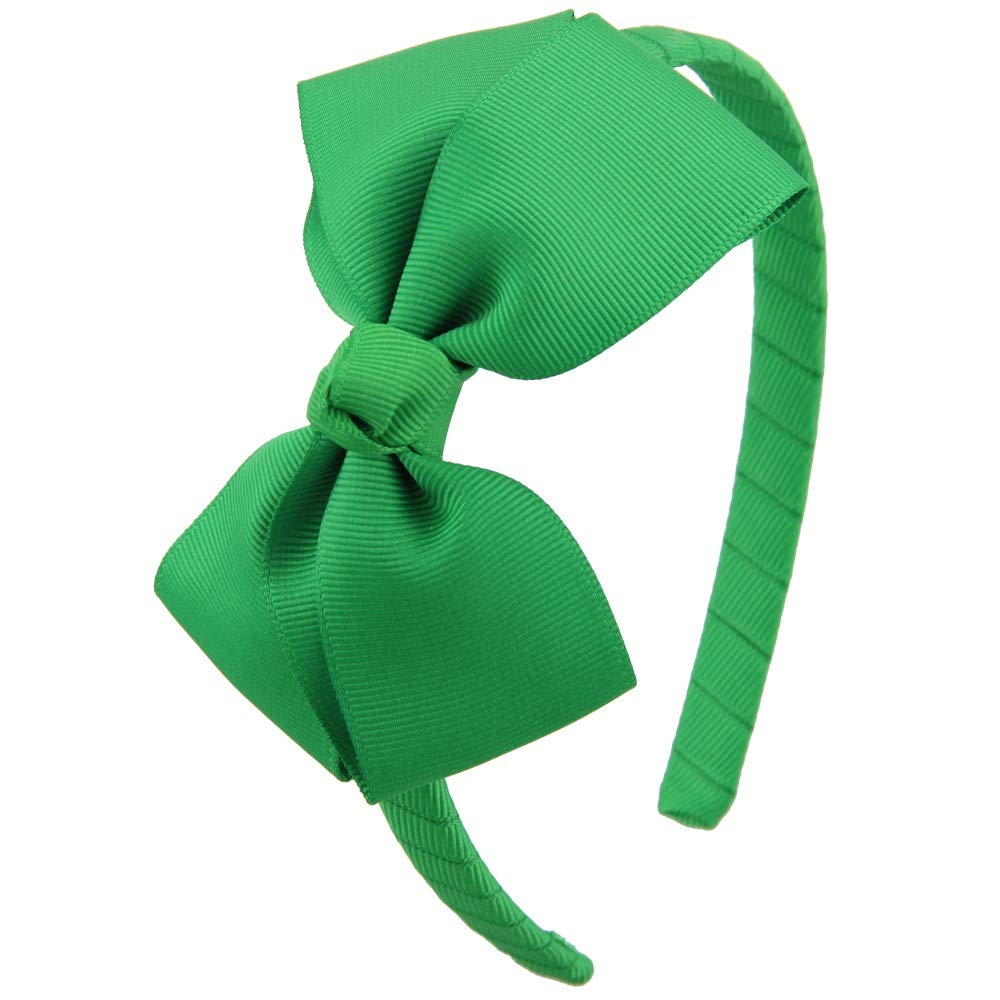 7Rainbows emerald green bow headband on a child, adding cute style and tidy hair.