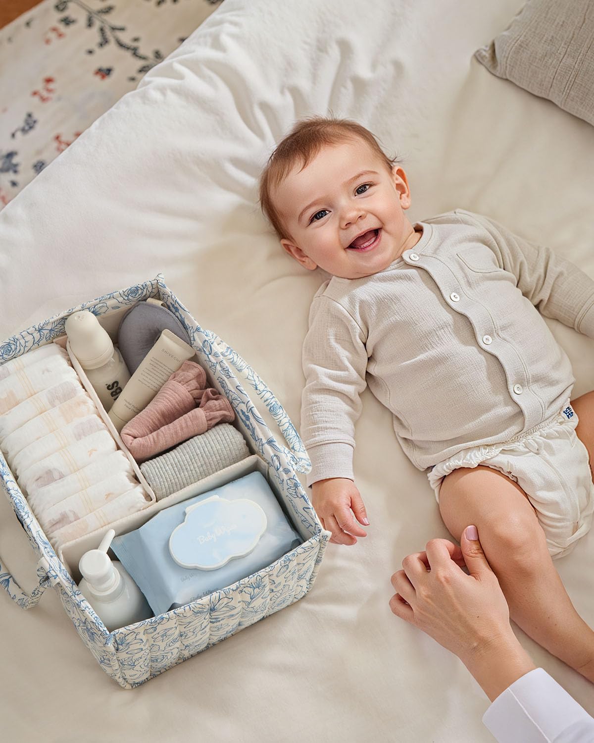Blissful Diary Floral Diaper Caddy in-use during a diaper change for quick access.