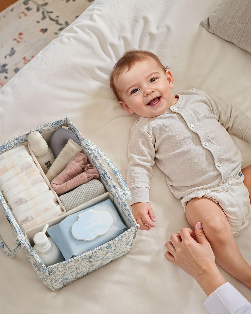 Blissful Diary Floral Diaper Caddy in-use during a diaper change for quick access.