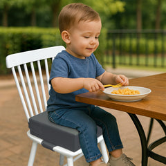 AAAini booster seat with safety belts adds extra chair-side security.