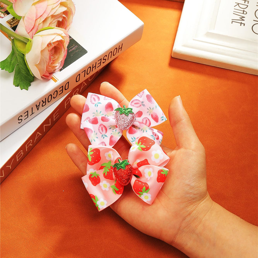 AACKS strawberry hair bows presented as a gift idea.