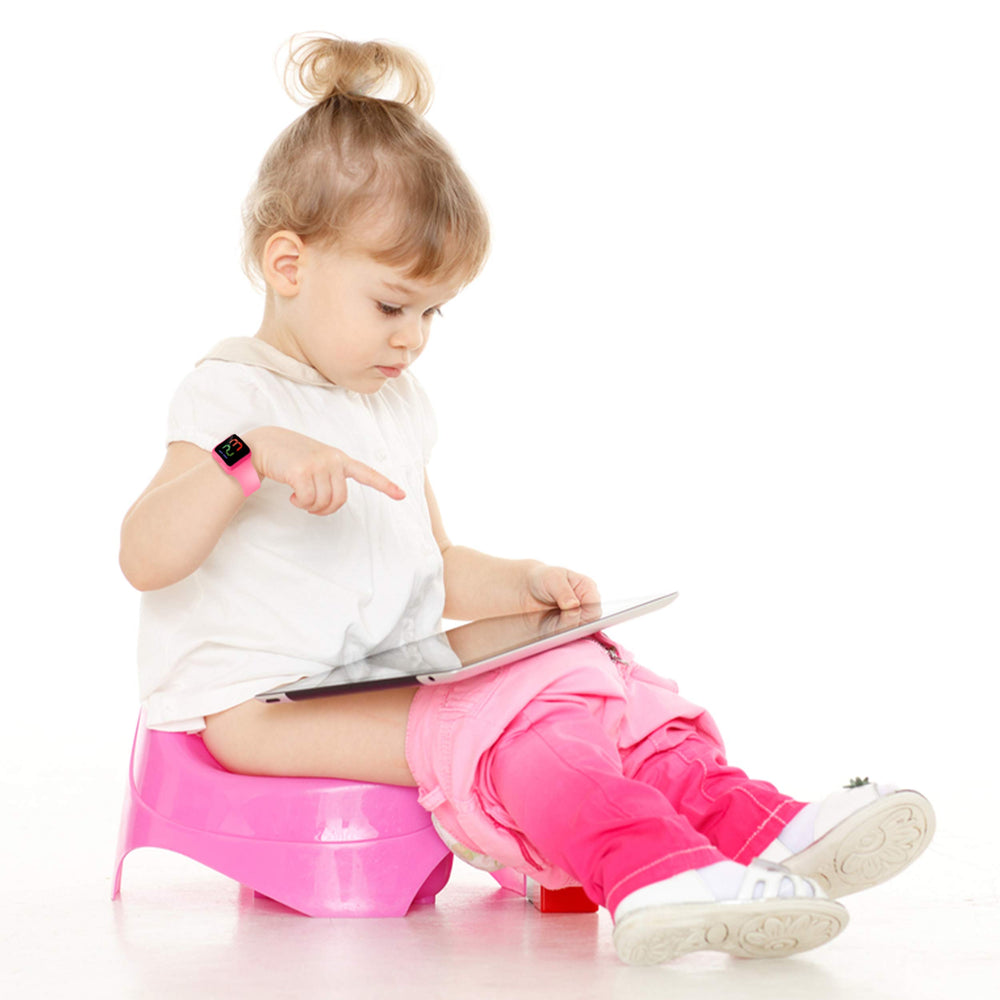 ABC123 Potty Training Watch 2 child wearing pink timer during playtime for easy routines.