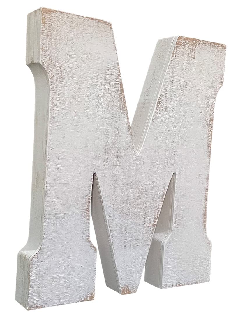ABELOTS distressed white-wash M letter sits on a shelf for nursery styling.
