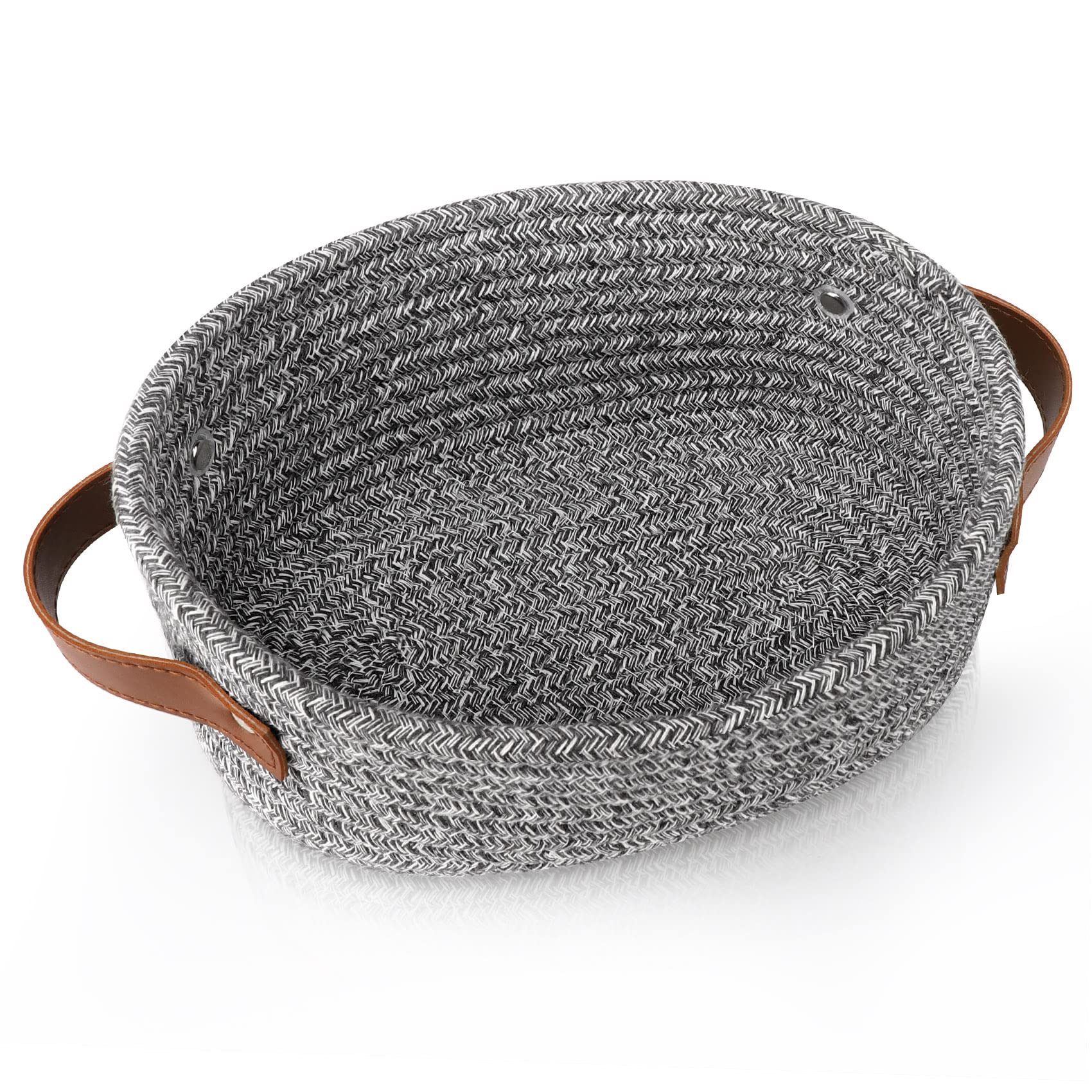 ABenkle small woven basket shown on a shelf for towels and small items.