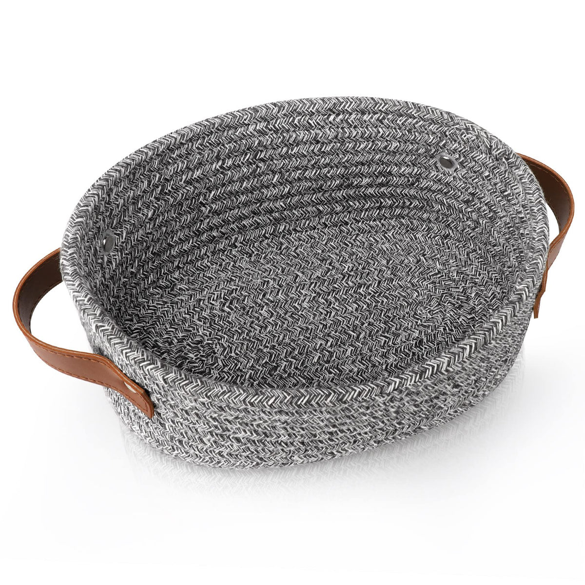 ABenkle small woven basket shown on a shelf for towels and small items.