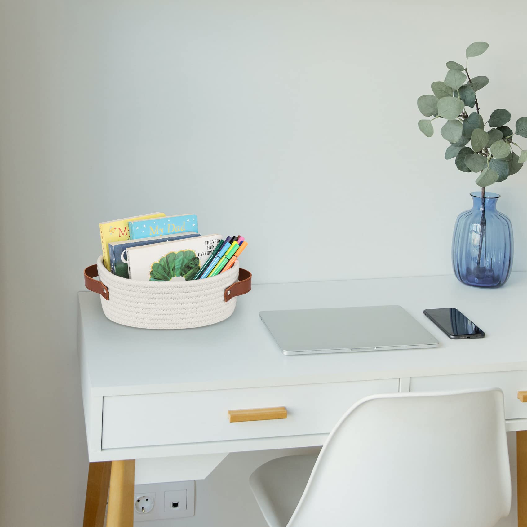 ABenkle small woven basket on a shelf for closet or bedside storage.