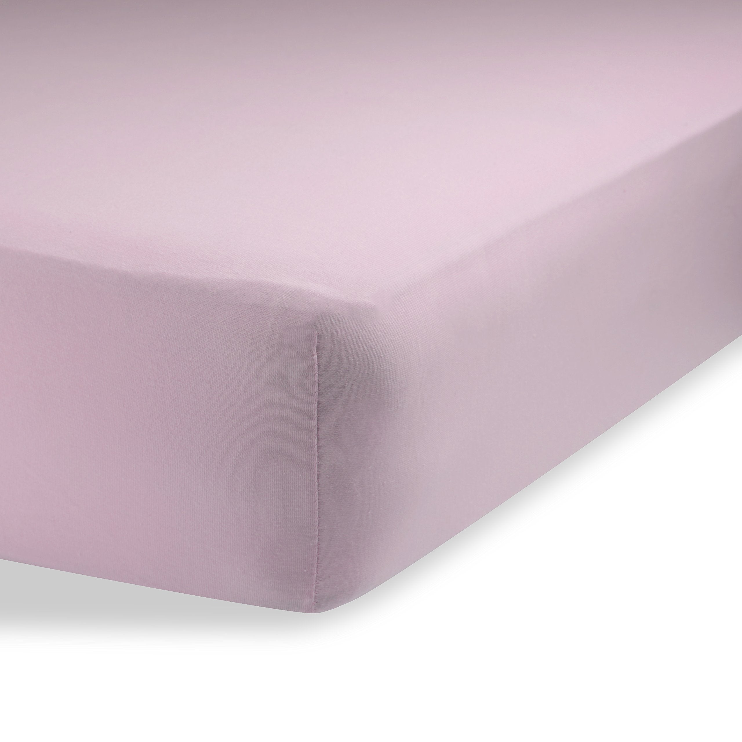 Abstract bassinet sheets in solid pink offer breathable, gentle comfort for baby sleep.
