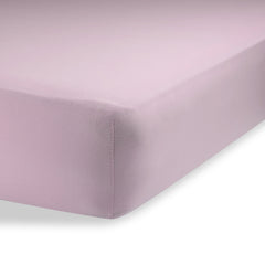 Abstract bassinet sheets in solid pink offer breathable, gentle comfort for baby sleep.