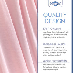 Stacked pink Abstract crib sheets illustrate color and fabric quality.