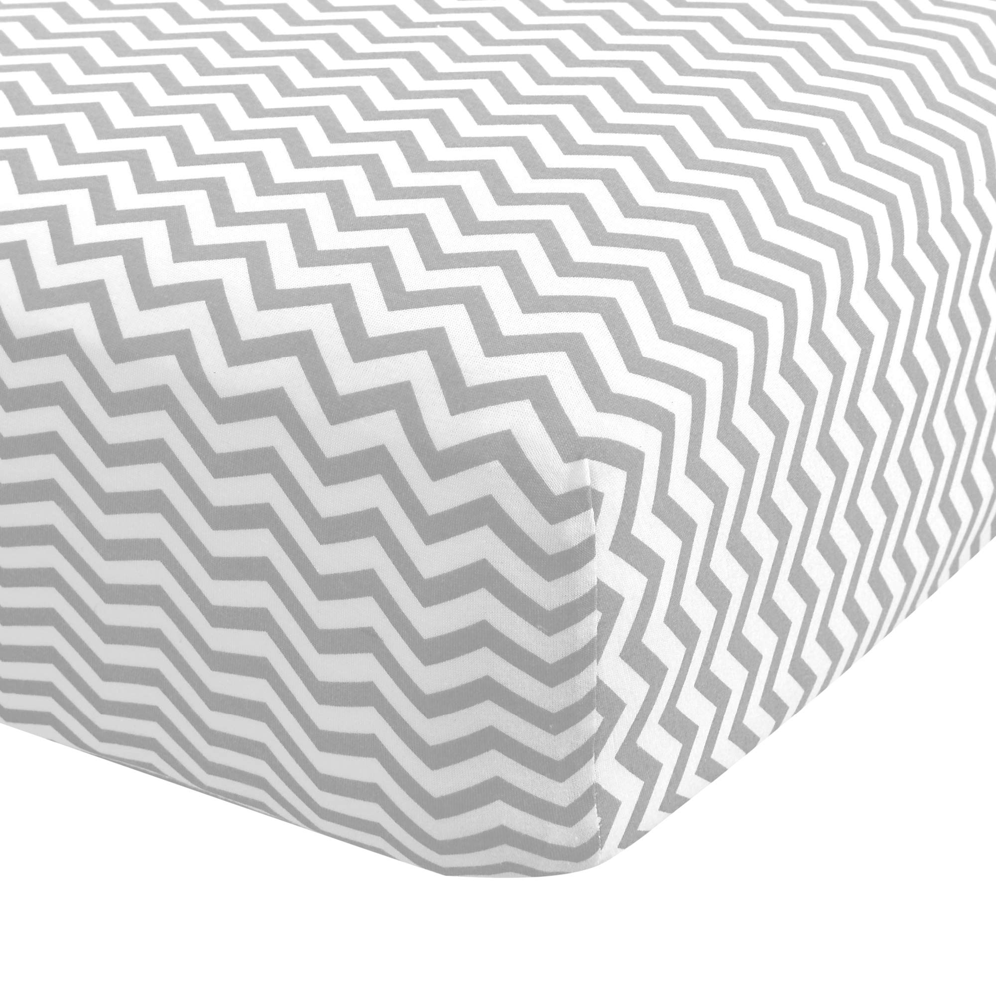 Abstract Cotton Crib Sheets gray zigzag folded for a soft, cozy nursery look.