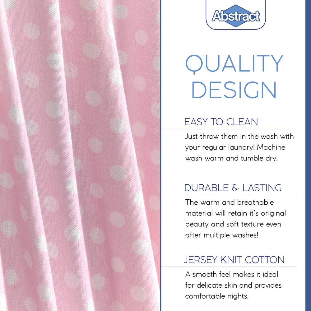 Abstract fitted sheets are machine washable for easy nursery care.