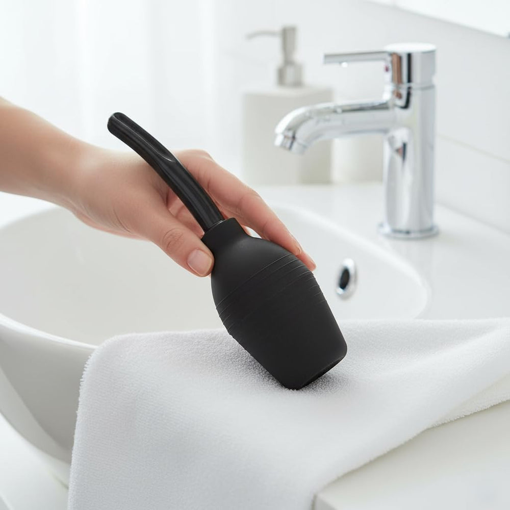 Abyclean anal douche bulb side view highlights comfortable grip for easy at-home cleansing.