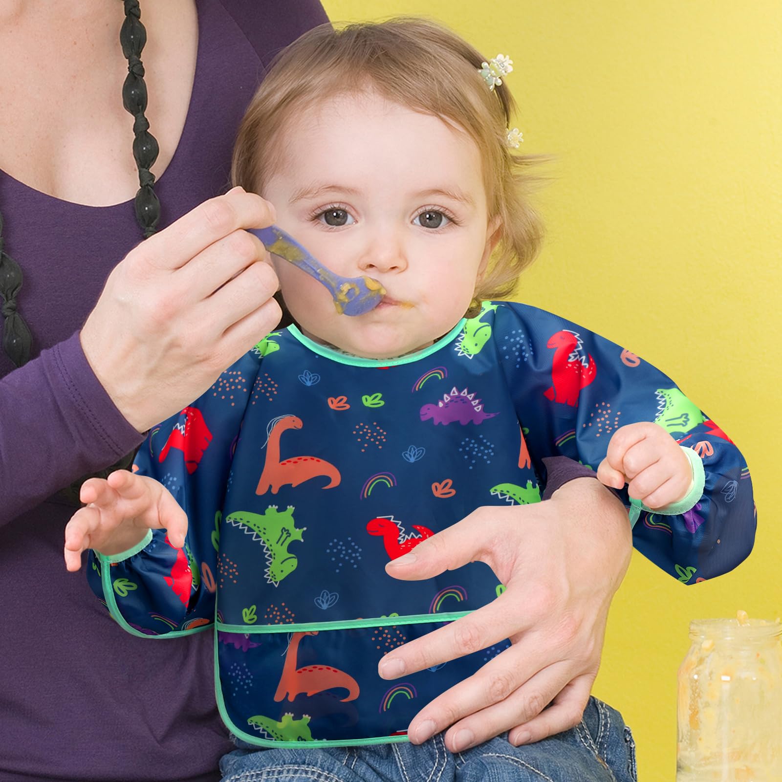Catch-all pocket on Accmor bib catching crumbs and drips during meals.