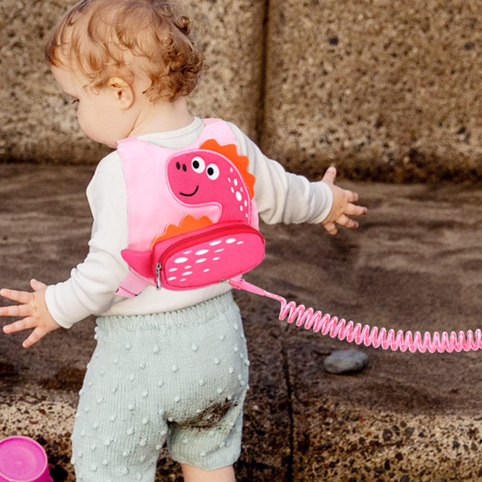 Accmor dinosaur harness front pocket for snacks and essentials during walks.