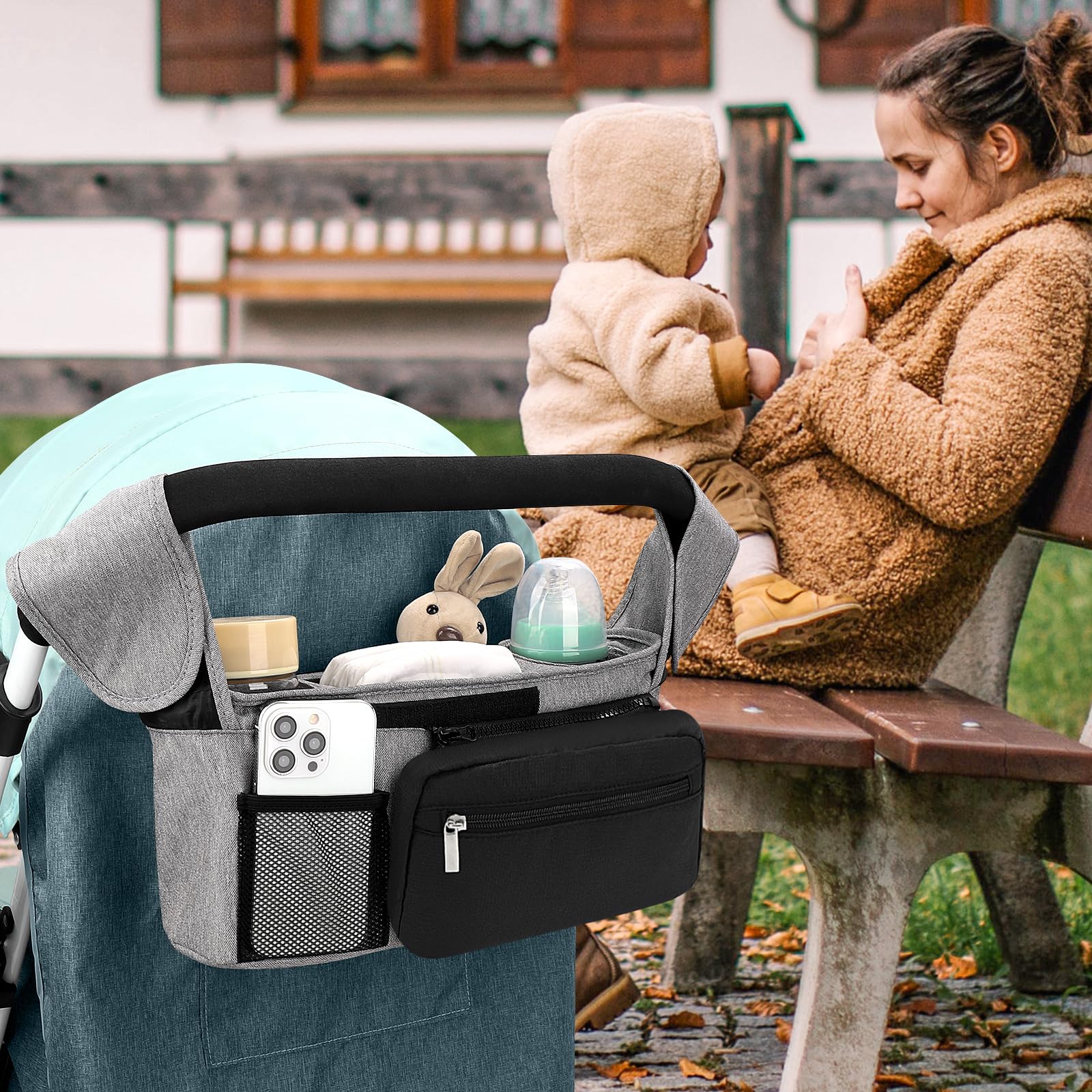 Accmor middle storage compartment organizes diapers, wipes, pacifiers, and toys.