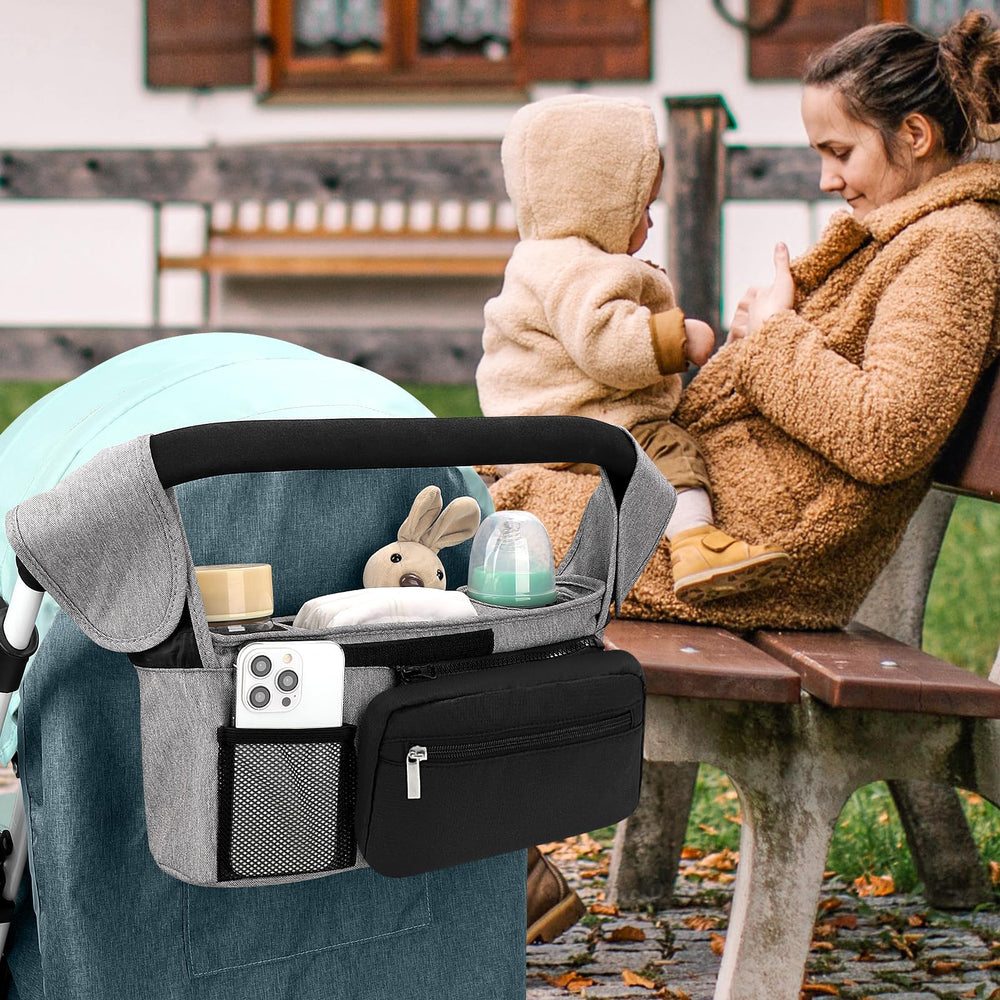 Accmor middle storage compartment organizes diapers, wipes, pacifiers, and toys.