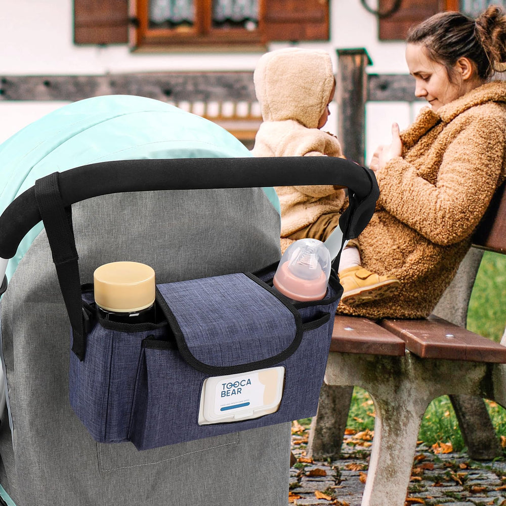 Accmor universal stroller organizer installed on a stroller with straps and carry option.