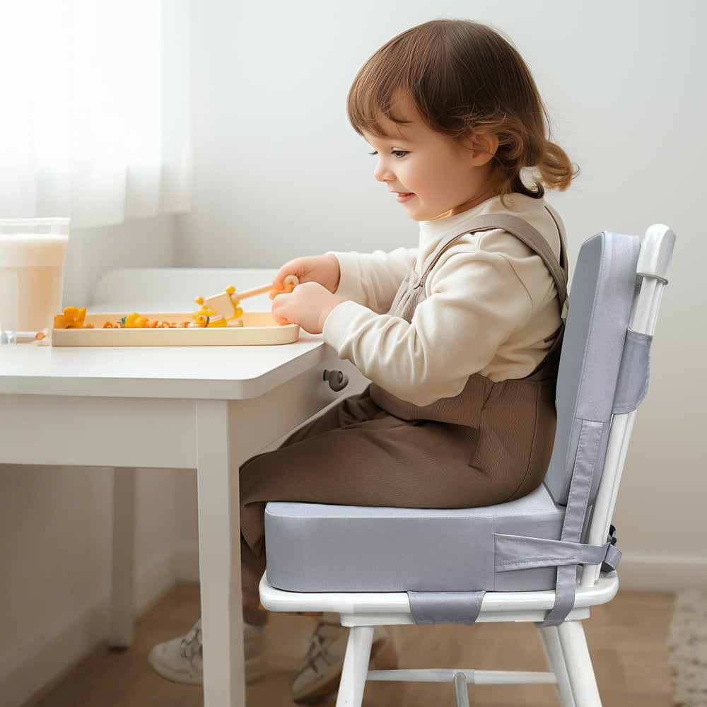 Acxseo booster seat backrest supports upright seating during family meals.