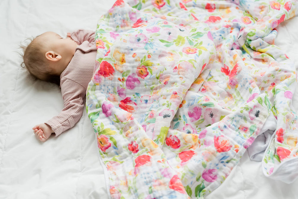 Addison Belle muslin cotton swaddle blanket shows soft texture and airflow for comfy naps.