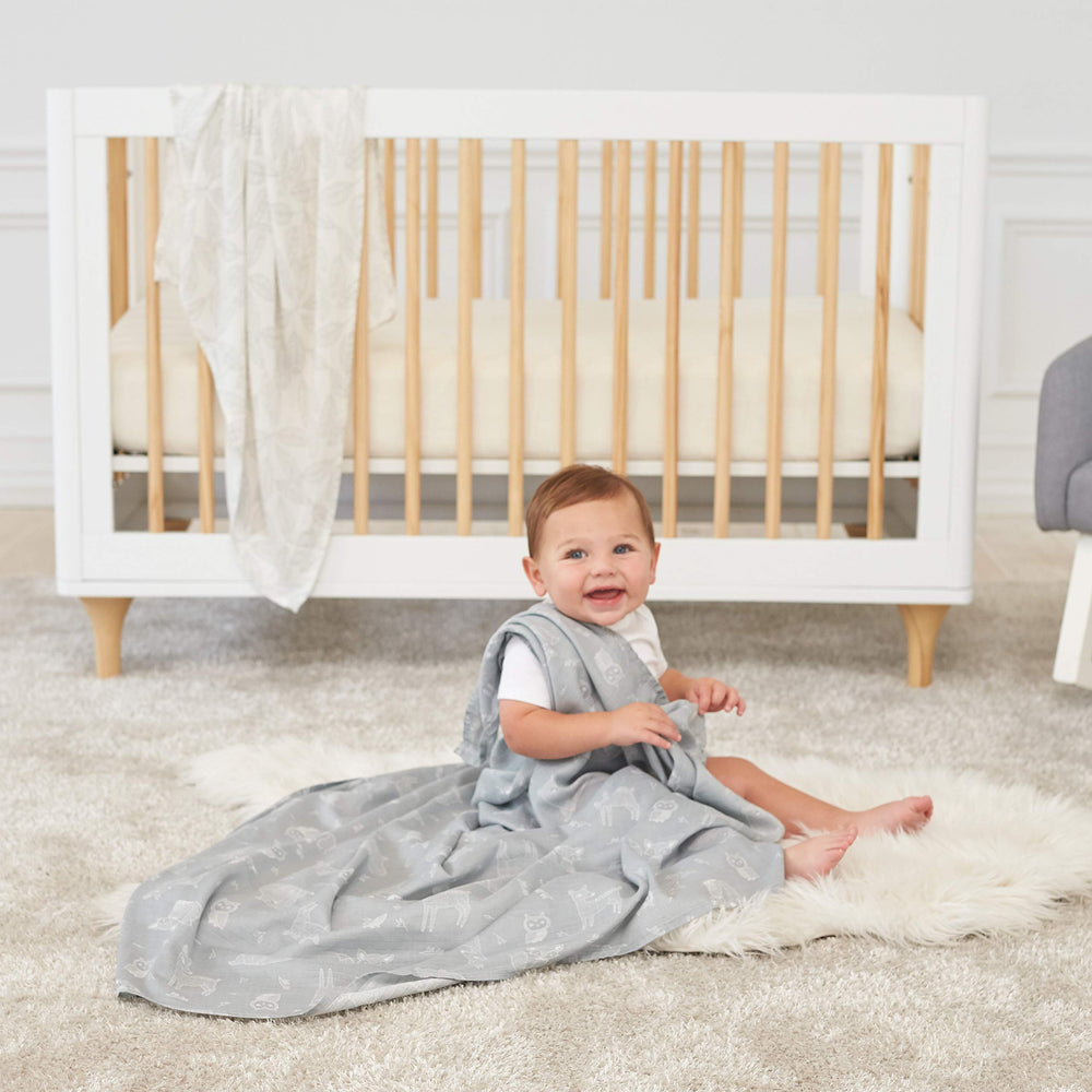 aden + anais silky soft swaddle used as stroller cover in warm weather