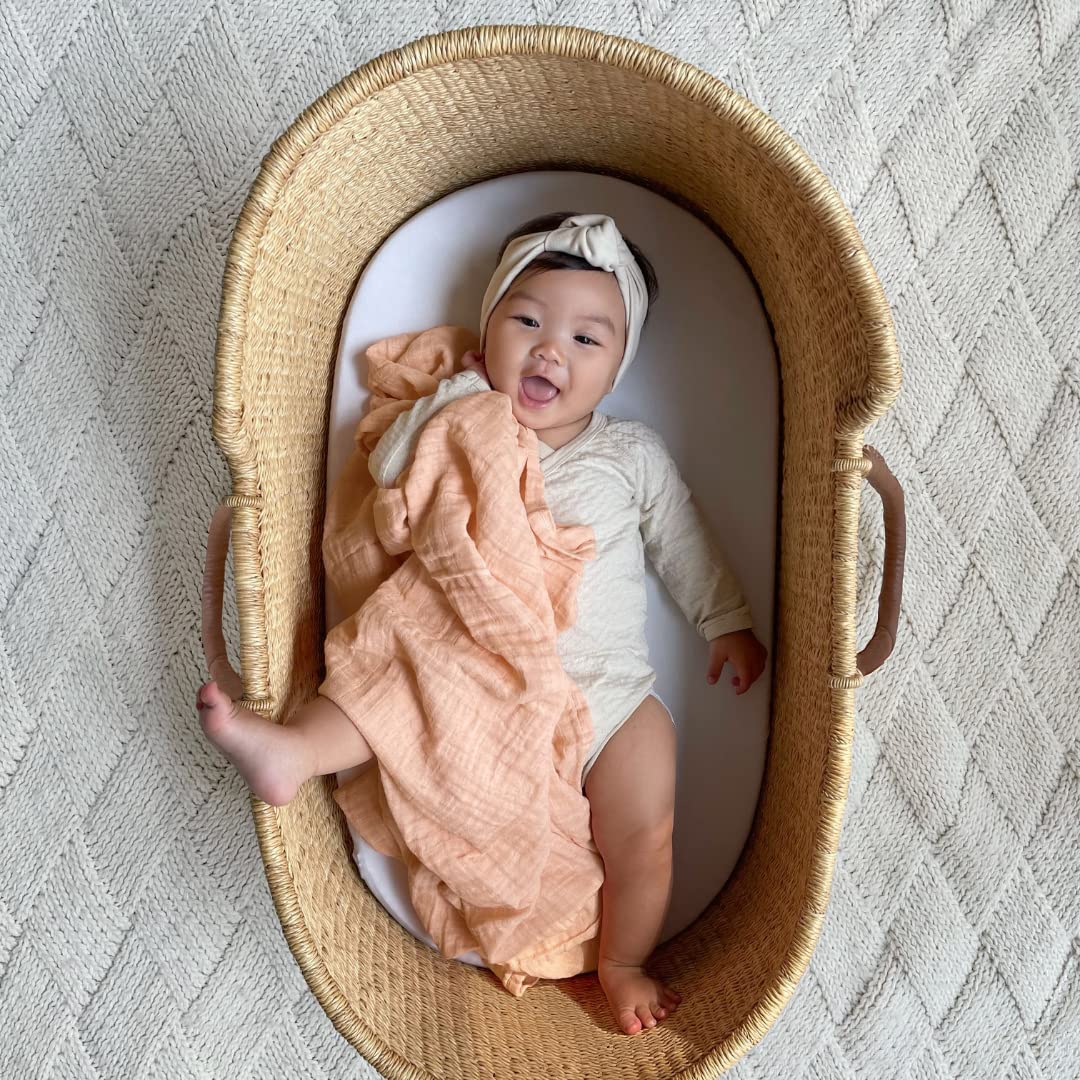 Stroller use of aden + anais swaddle blanket for lightweight coverage.