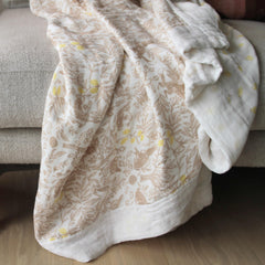 Colorful signature prints on Aden + Anais Dream Blanket for nursery style