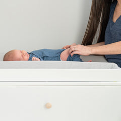 aden and anais changing pad cover elastic border visible for a secure fit on standard pads.