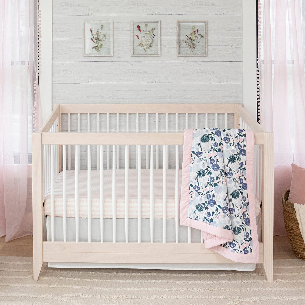 aden + anais Essentials crib skirt coordinates with nursery decor for a polished look