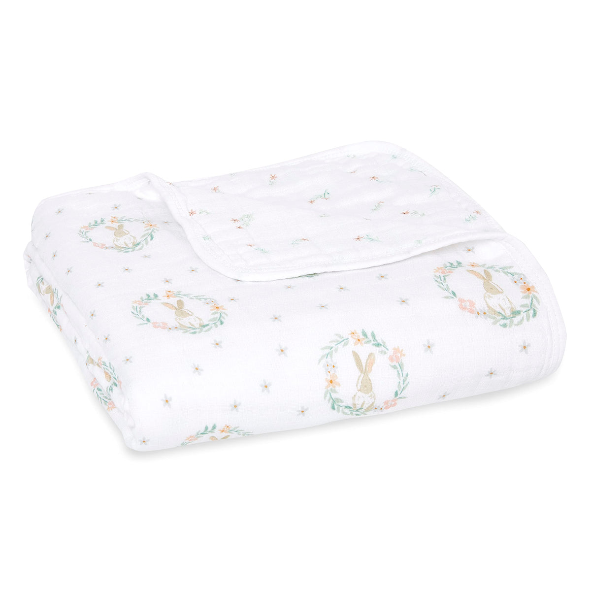 aden + anaïs Essentials Dream Blanket laid flat, breathable four-layer muslin for newborn comfort.