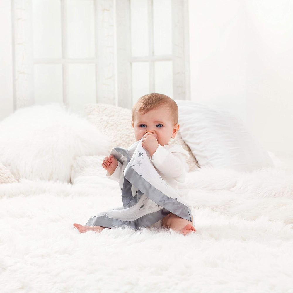 Close-up of satin trim on aden + anais Issie security blanket Safari Babes