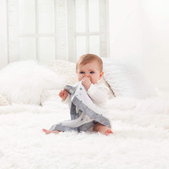 Close-up of satin trim on aden + anais Issie security blanket Safari Babes