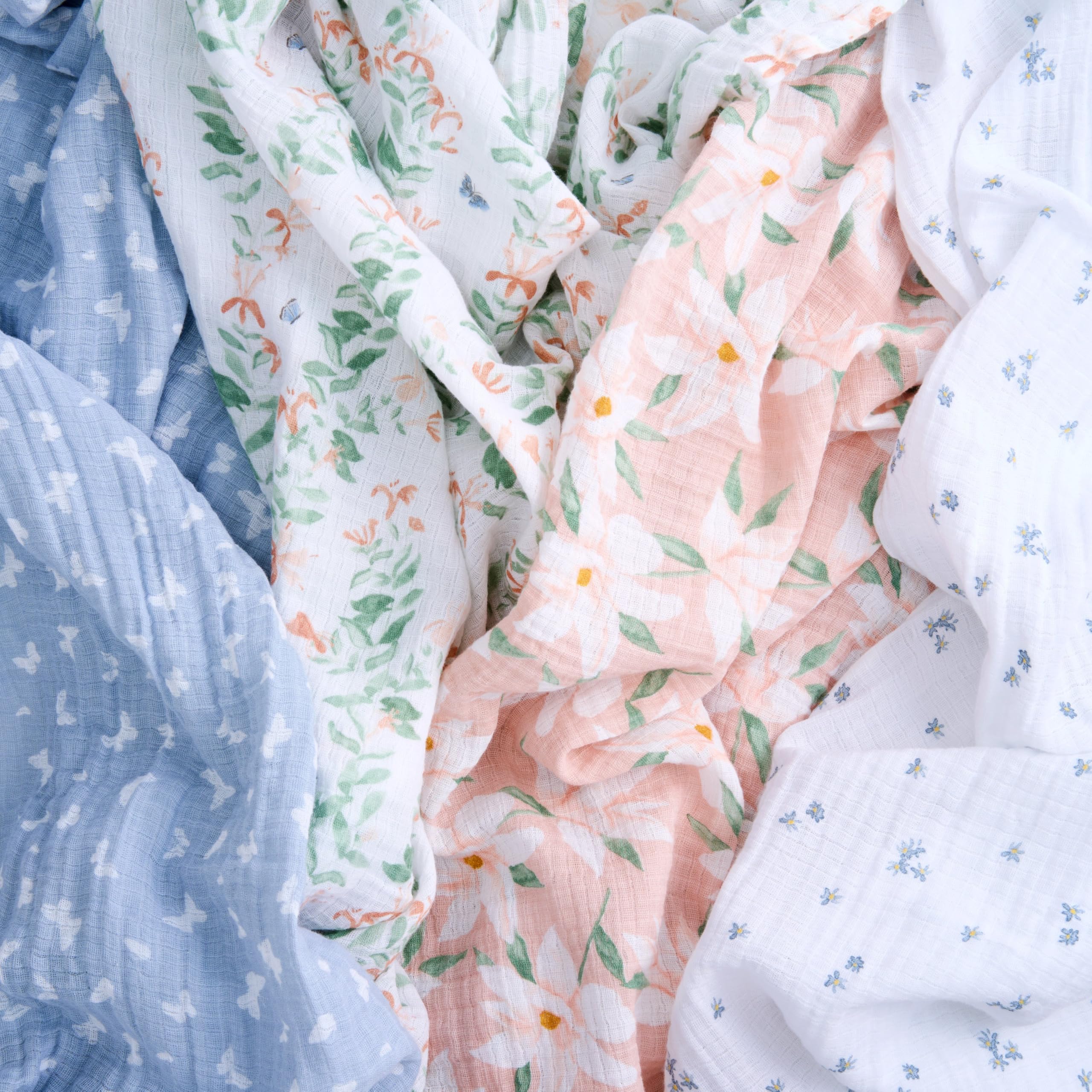 aden + anais Butterfly Garden swaddle in nursery, multiple-use blanket for burp cloth or cover.