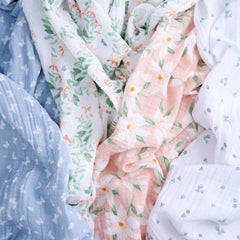 aden + anais Butterfly Garden swaddle in nursery, multiple-use blanket for burp cloth or cover.