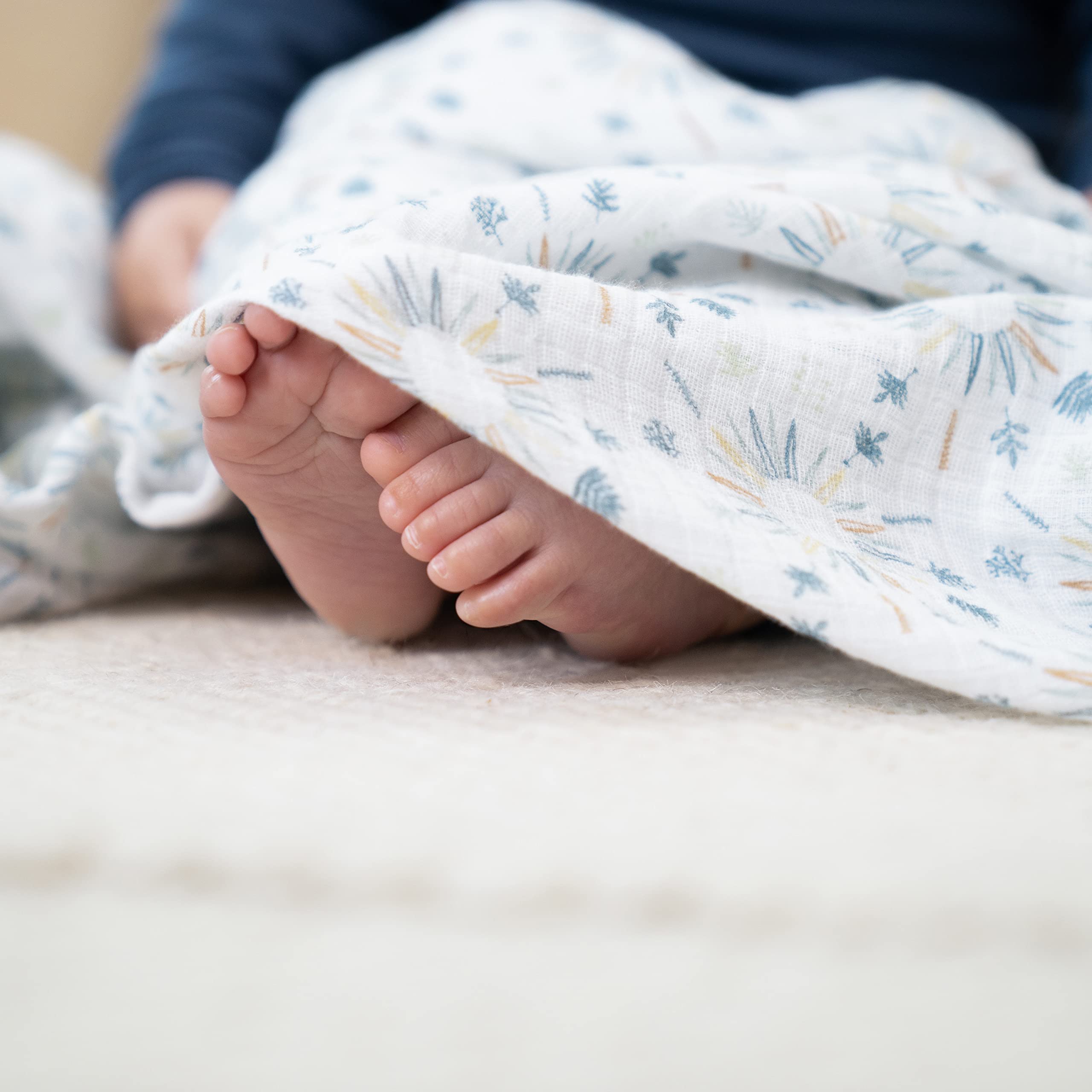 aden and anais Essentials muslin swaddle used as nursing cover for discreet feeds.