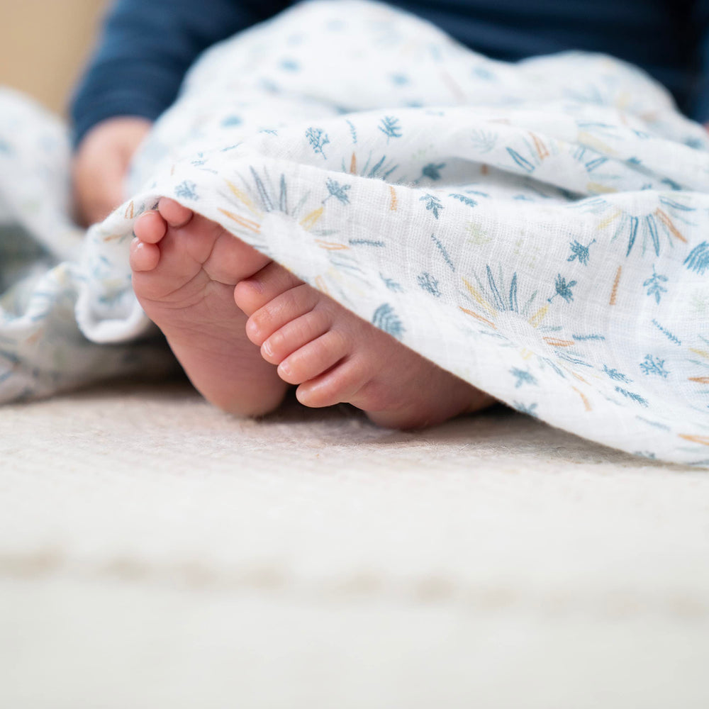 aden and anais Essentials muslin swaddle used as nursing cover for discreet feeds.