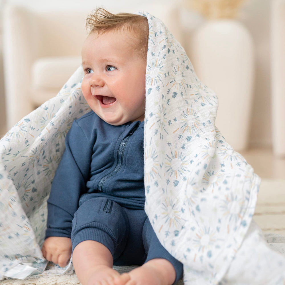 aden and anais Essentials muslin swaddle used as stroller cover on the go.