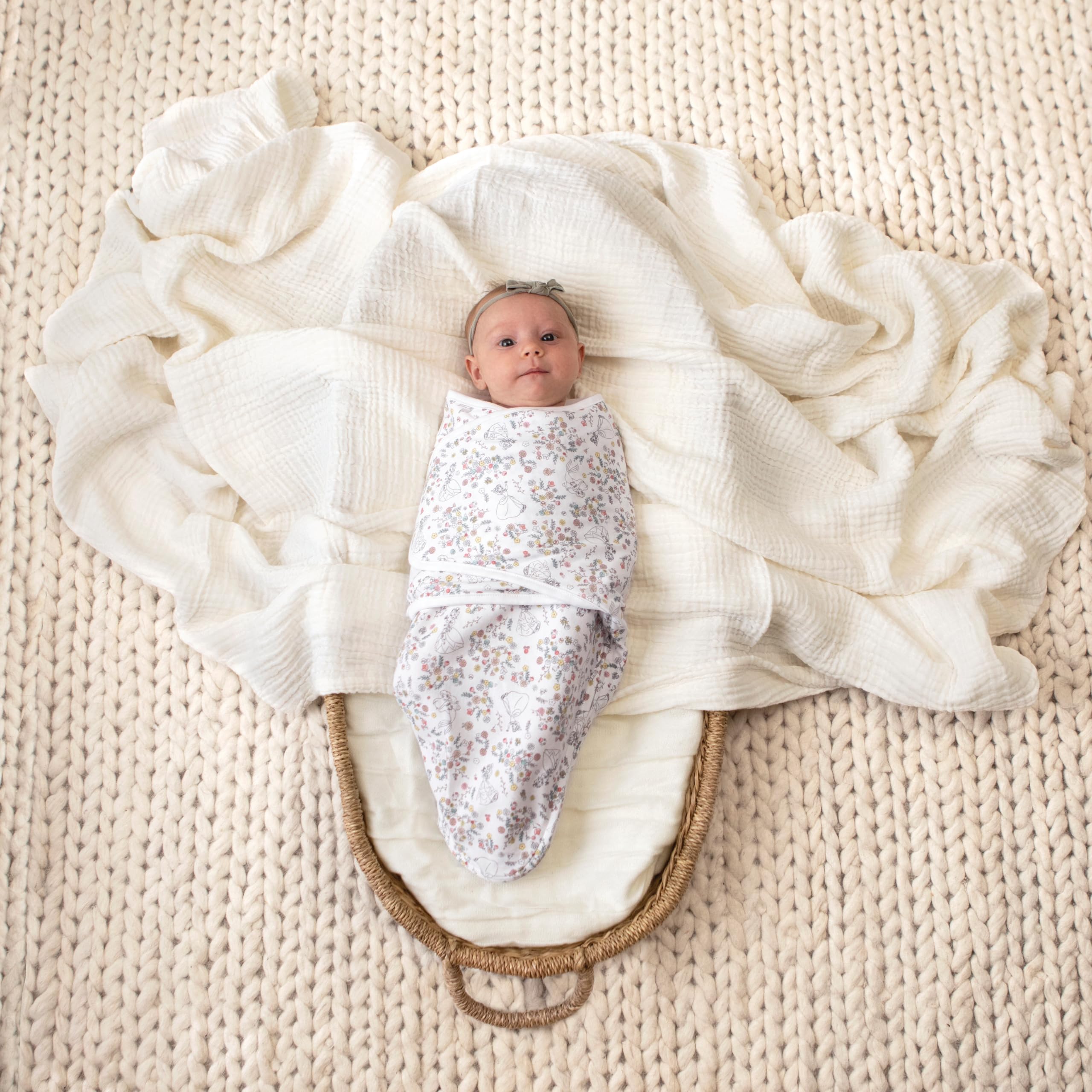 aden + anais Essentials swaddle with adjustable fit for snug, womb-like sleep.