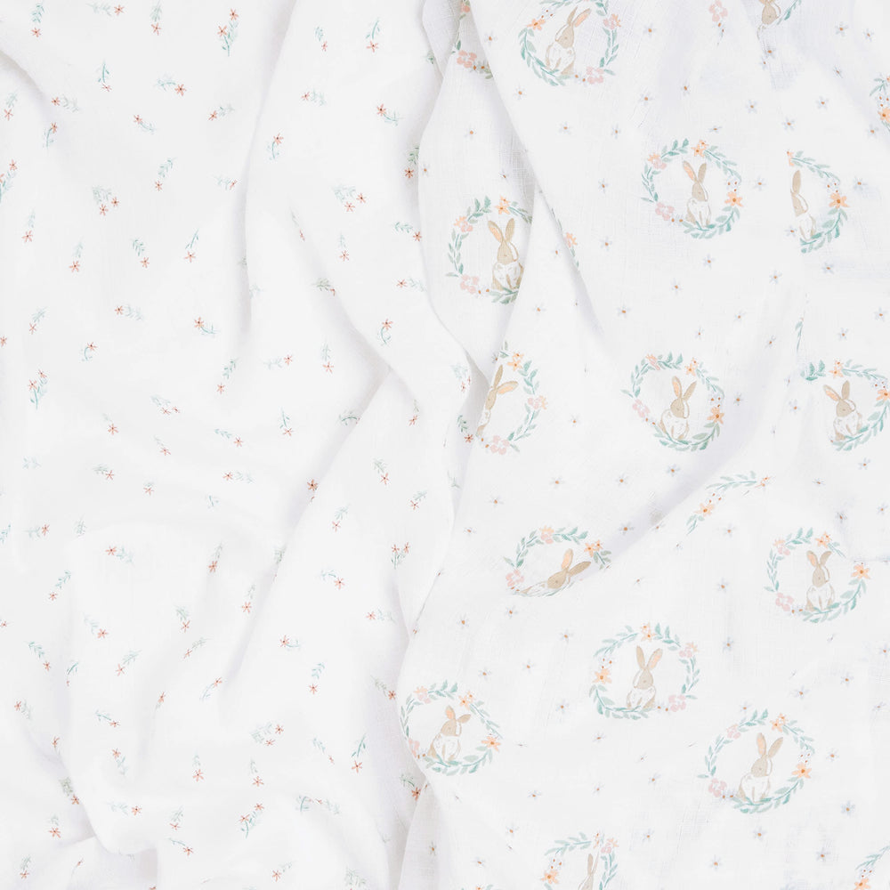 aden-anais Essentials Swaddle Blanket Blushing Bunnies used as stroller cover on outings.