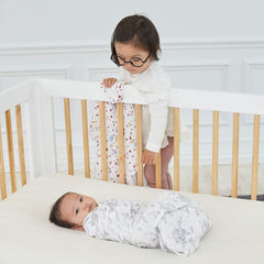 aden + anais Harry Potter swaddle blanket swaddling position demonstrates snug wrap for sleep