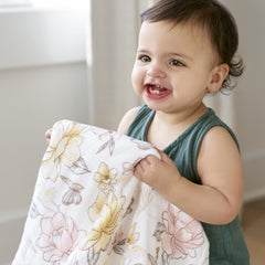 aden + anais blanket around baby during tummy time for cozy drape