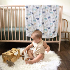 aden + anais Silky Soft Dream Blanket in crib, lightweight layer for a breathable nap environment.